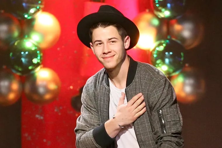 Host Nick Jonas speaks onstage at 101.3 KDWB's Jingle Ball 2014.