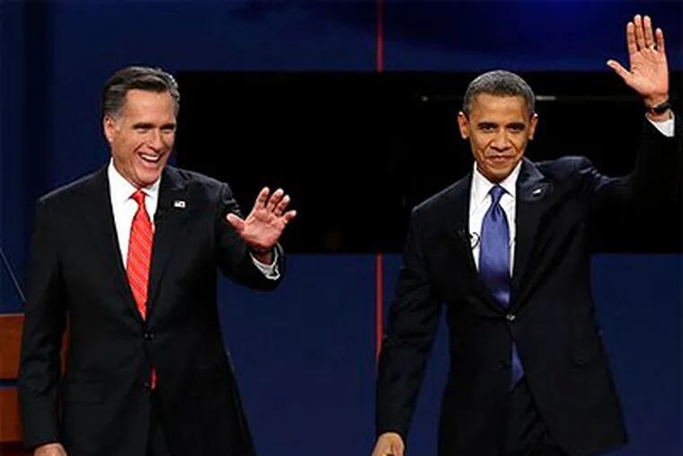 FILE - In this Oct. 3, 2012, photo, Republican presidential candidate Mitt Romney and President Barack Obama wave to the audience during the first presidential debate at the University of Denver in Denver. (AP Photo / Charlie Neibergall, File)