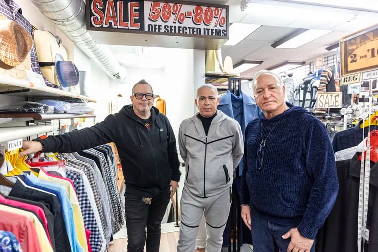 From left, Bob Taylor, 52, Mario Maldonado, 66, and Louis Zulli, 67, are co-owners of A Man’s Image clothing store in South Philadelphia. The store is closing its doors at the end of March.
