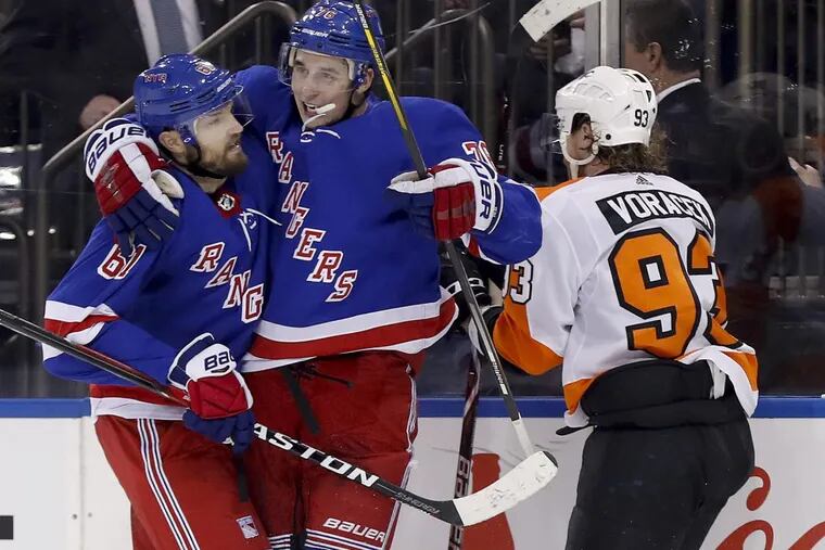 Rangers right wing Rick Nash (61) and  defenseman Brady Skjei (76) celebrate after Nash scored during the second period.