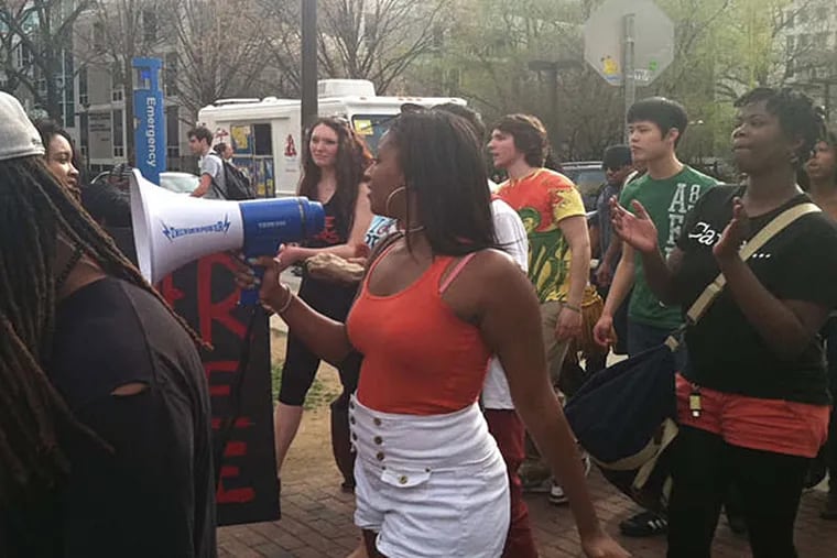 At the Bell Tower: 'Soufas must go!' Temple University students protest last week over the school's choice of candidates to head the African-American Studies Department.  (Valerie Russ/Staff)