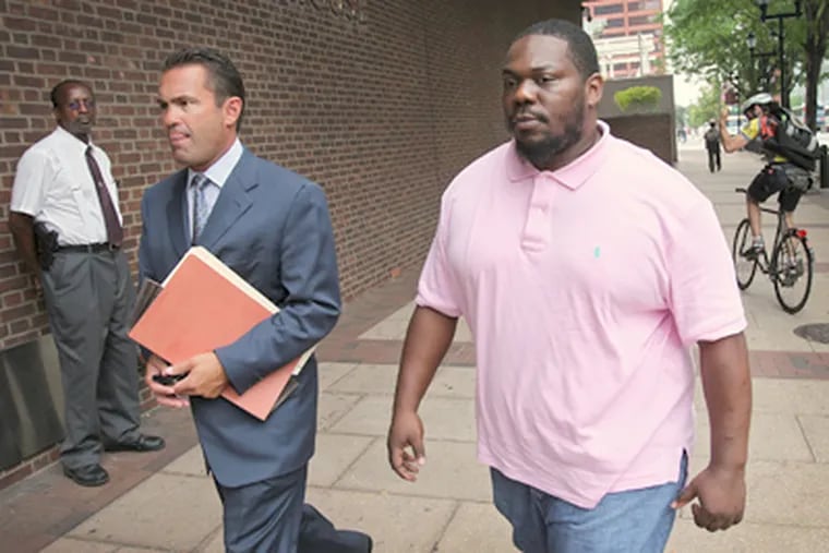 Rapper Beanie Sigel (right) arrives with attorney Fortunato N. Perri Jr. at the federal courthouse in Philadelphia on Tuesday. (Alejandro A. Alvarez / Staff Photographer)