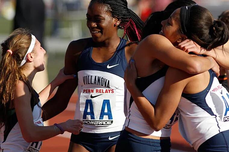 The Villanova team celebrate after winning the College Women's
Distance Medley Championship during the Penn Relays at Franklin Field
on Thursday, April 25, 2013.  (Yong Kim/Staff Photographer)