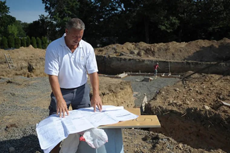 Lou Chiellini reviewing the plans for a home his company, Chiellini Construction, is building in Park Ridge, New Jersey. (Amy Newman/The Record/MCT)