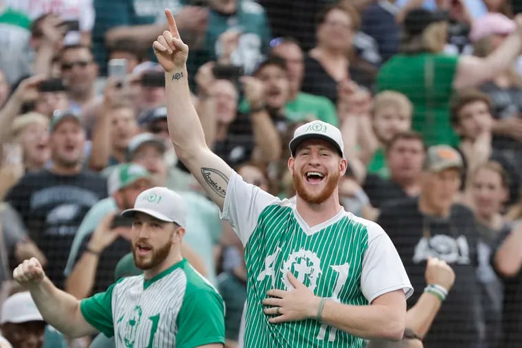 Eagles quarterback Carson Wentz cheers during a home run hitting contest during his charity softball game at Citizens Bank Park on Friday, May 31, 2019.