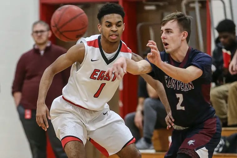 Eastern's Andrew Heck throws a pass in front of Cherry Hill East's Carl Gibson Jr., during the 1st quarter in Cherry Hill, NJ, Tuesday,  January  22, 2019.  Eastern beat Cherry Hill East   61-51.