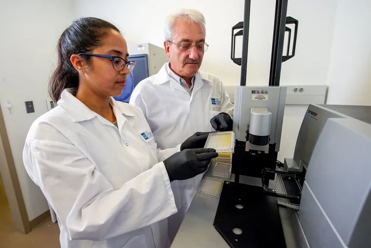 Ami Patel, research assistant professor, and David B. Weiner, director of Wistar Institute's vaccine and immunotherapy center, working on his synthetic DNA vaccine technology, the basis for an experimental coronavirus vaccine.
