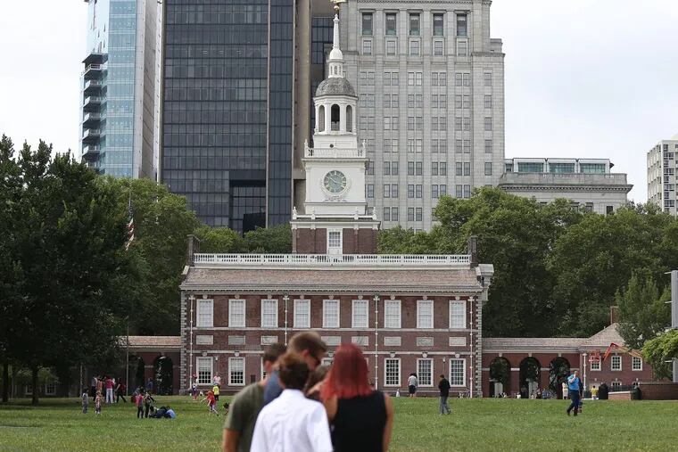 Tourists gather on Independence Mall in Philadelphia in July.