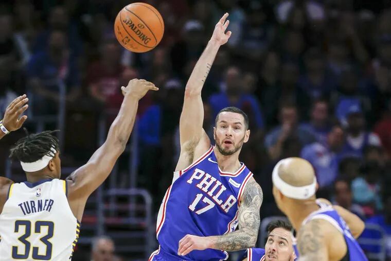 Sixers forward JJ Redick passes the basketball over teammate guard T.J. McConnell to guard Jerryd Bayless (right) against Pacers center Myles Turner on Friday.