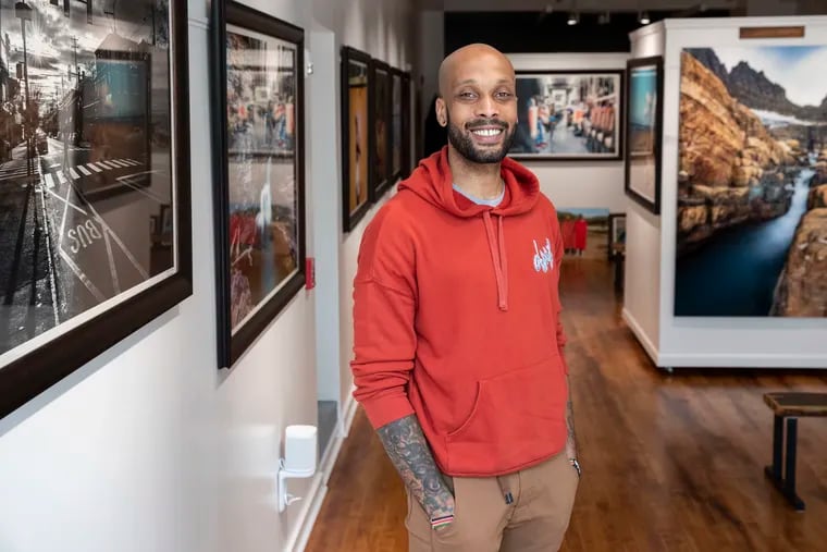 Photographer Steven CW Taylor at his Ubuntu Fine Art gallery. He opened the space in September as a showcase for his work — and to give visitors a chance to immerse themselves in the world's places, and possibilities.