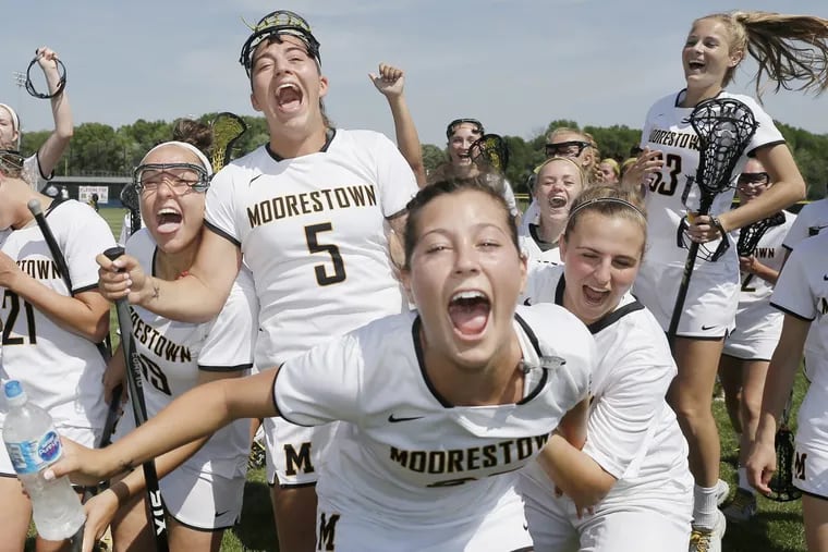 The Moorestown girls celebrate after winning the Ocean City at Moorestown HS South Jersey Group 3 ladies lacrosse final on May 25, 2018. Moorestown won the game 18-3.