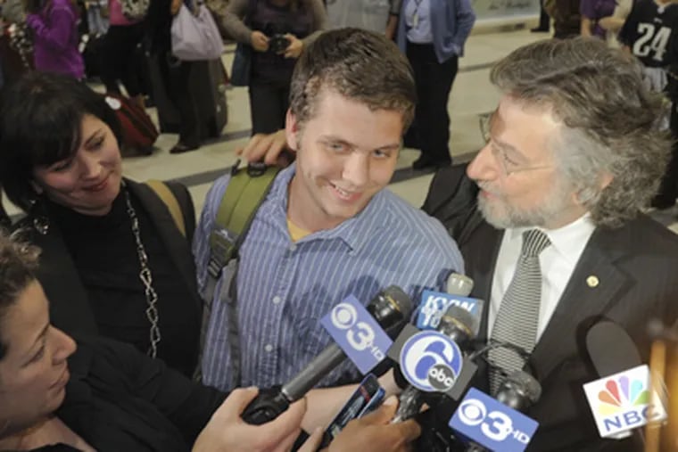 Greg Porter, the 19-year-old Drexel University student who was arrested in Egypt during protests is greeted at Philadelphia International airport by his mother Nancy Porter and Attorney Theodore Simon. (Ron Tarver / Staff Photographer)