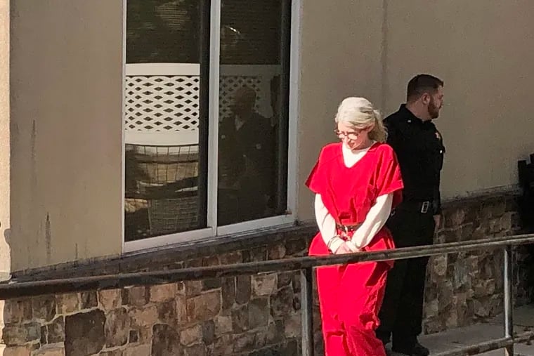 Beth Peterson, seen leaving a magisterial district courthouse in Aston, has been charged with first- and third-degree murder in the death of her boyfriend, Matthew Wilcox.