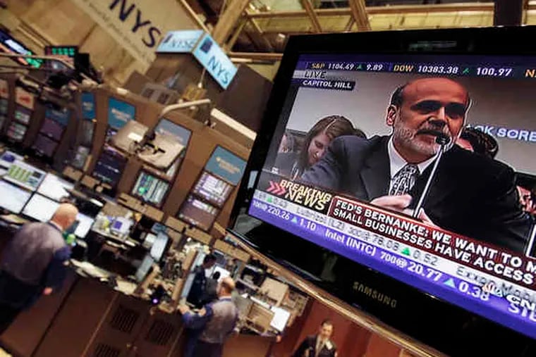 Fed Chairman Ben S. Bernanke's testimony before Congress is shown on a large TV on the floor of the New York Stock Exchange.