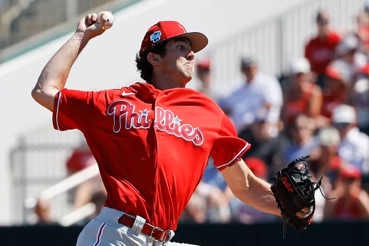 Phillies pitcher Andrew Painter throws the baseball during a spring training game.