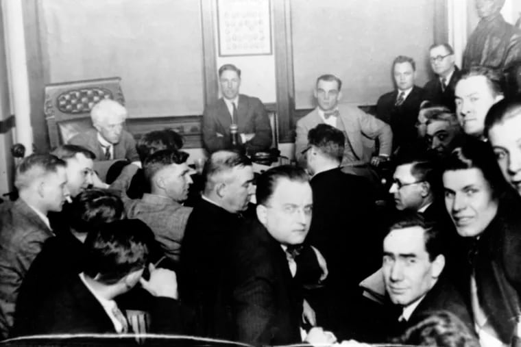 In this 1921 file photo, Judge Kenesaw Mountain Landis, rear left, talks with Chicago White Sox players during the investigation of the infamous "Black Sox" scandal in Chicago, Ill. At rear center is Charles "Swede" Risberg, and next to Risberg is Arnold "Chick" Gandil. Others are unidentified.