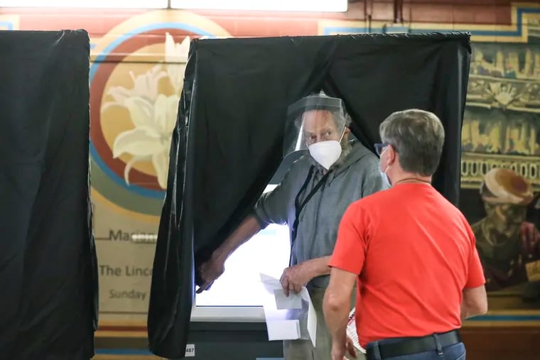 People vote in the Pennsylvania primary election at the Marian Anderson Recreation Center in Philadelphia on June 2, 2020. Republicans are pushing stricter voting rules, including requiring all voters to show identification at the polls.