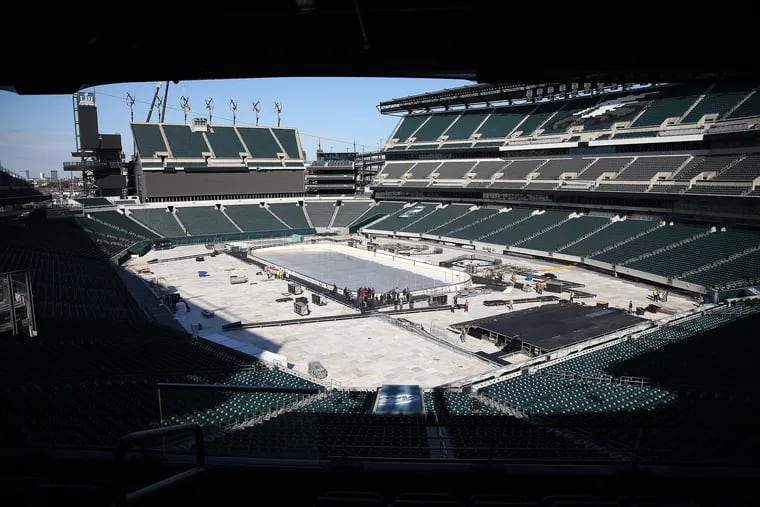 Media gathered near the rink last week during preparations for the NHL Stadium Series at Lincoln Financial Field.