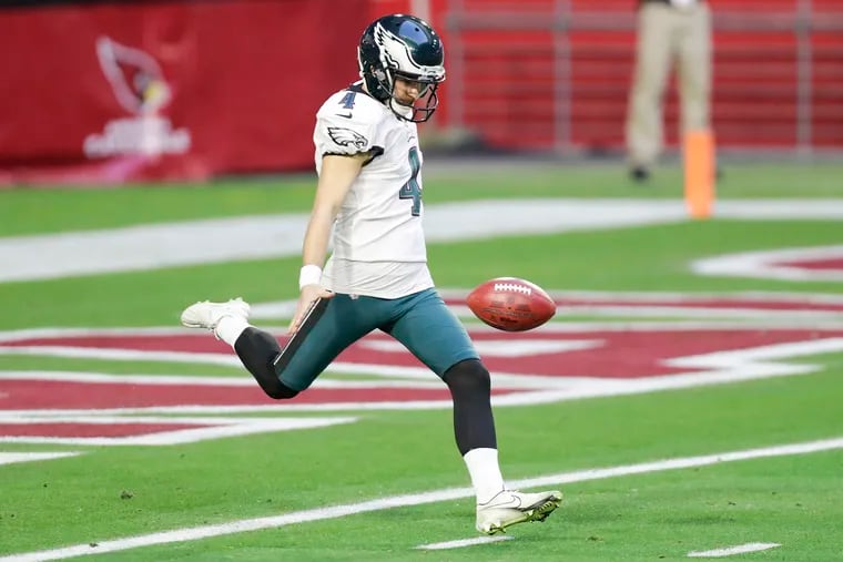 Eagles kicker Jake Elliott punts the football in the third quarter against the Arizona Cardinals on Sunday in a 33-26 loss.