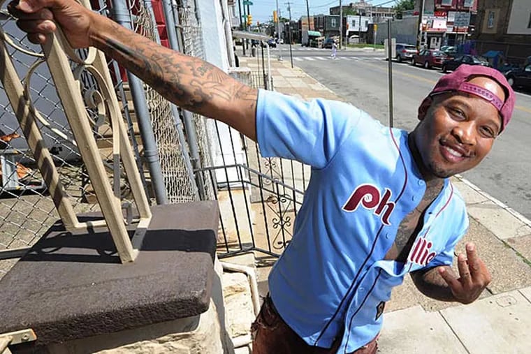 Rapper Mont Brown on South 55th Street, where he is going to throw another block party to promote education, the arts, and small business on Saturday. (Clem Murray/Staff Photographer)