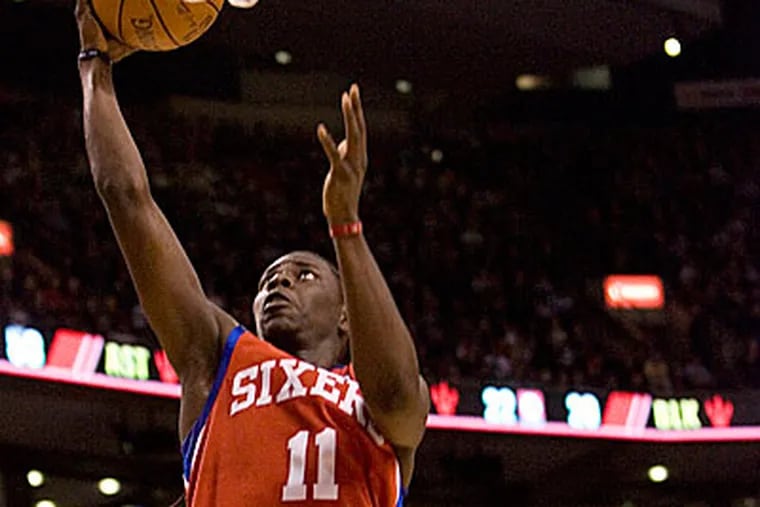 Jrue Holiday made some big shots in the 76ers' win over the Raptors. (Chris Young / AP Photo)