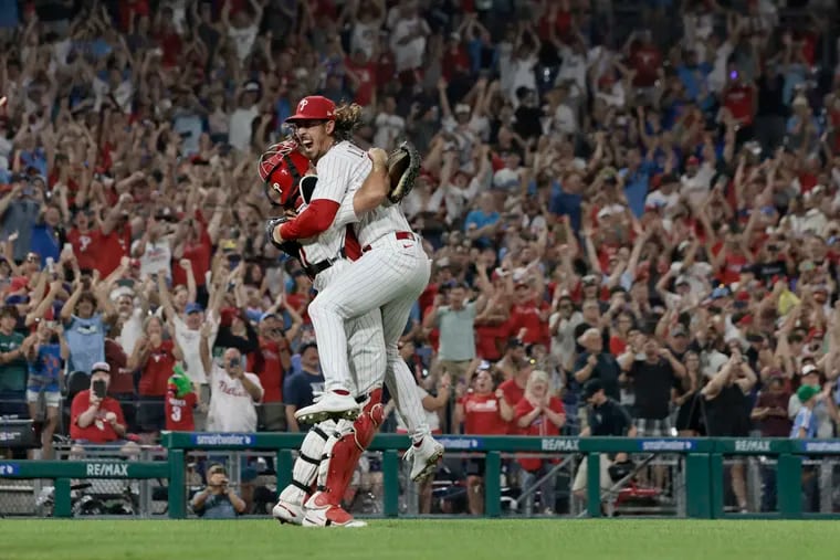 J.T. Realmuto picks up Michael Lorenzen after Lorenzen threw a no-hitter against the Nationals at Citizens Bank Park on Wednesday.