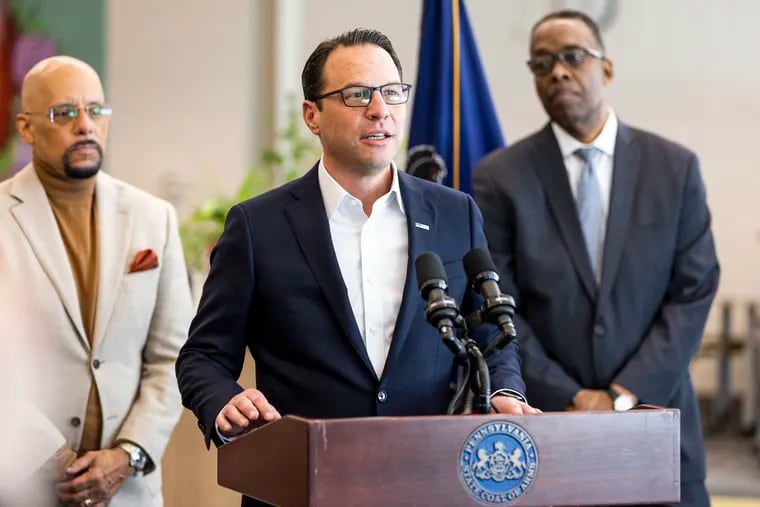 Gov. Josh Shapiro speaks to the media during his visit to George Washington Carver High School of Engineering and Science in Philadelphia on Wednesday.