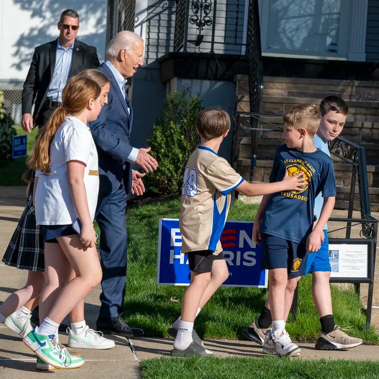 President Joe Biden leaves with school children after a visit to his childhood home in Scranton Tuesday Apr. 16, 2024, on the first stop in his three-day Pennsylvania campaign tour.