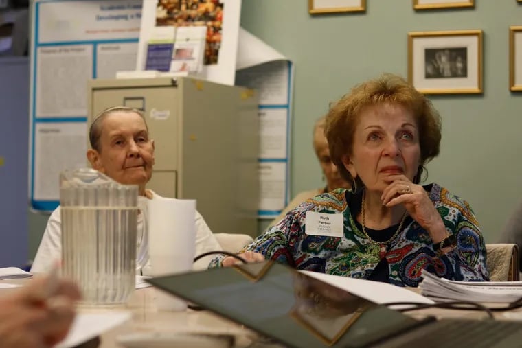 Penn’s Village members Evelyn Kobler, left, and Ruth Ferber, right, listen as Richard Salkowitz  talks about Medicare Part D.