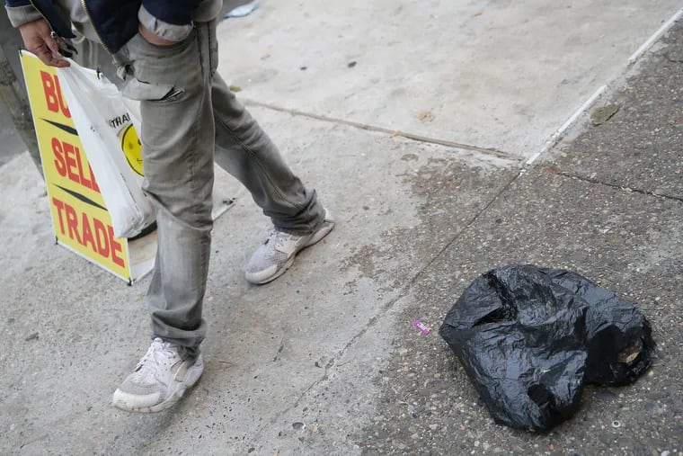 A discarded plastic bag is pictured along Kensington Avenue near McPherson Square in Philadelphia on Saturday, Nov. 9, 2019.