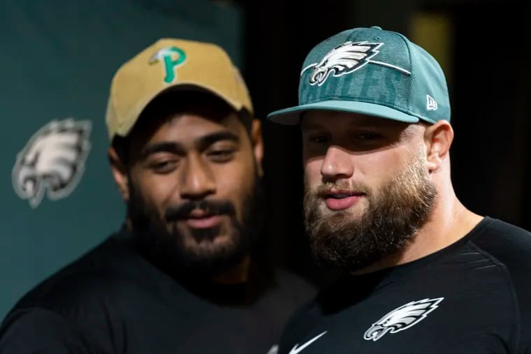 Jordan Mailata, left, and Lane Johnson were invited to the White House on Dec. 21 to perform a track off their Eagles’ Christmas album as a surprise for first lady Jill Biden.