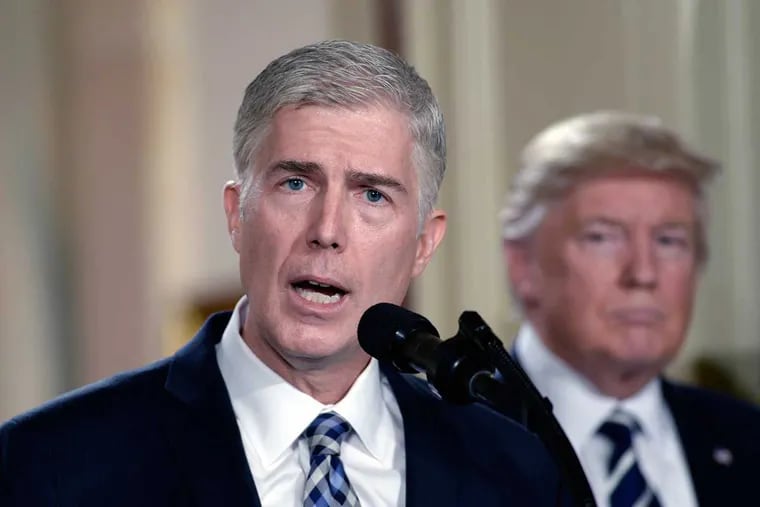 Supreme Court nominee Judge Neil M. Gorsuch speaks as President Trump looks on in the East Room of the White House on Tuesday.