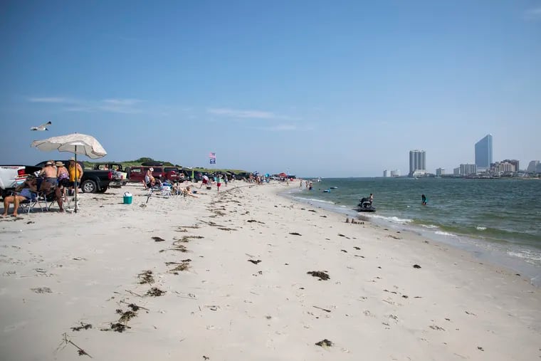 locals and beach goers enjoy the beach in Brigantine, N.J., on Wednesday, July 17, 2019. The cove has long been known for a fun vacation spot, but recently, locals and officials are concerned how the beach is treated with littering.