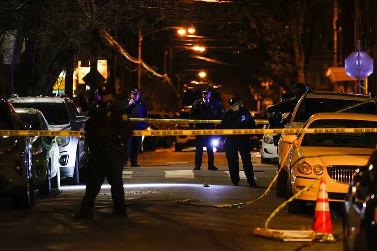Philadelphia police investigate the fatal shooting of a Temple University police officer along the 1700 block of West Montgomery Avenue in North Philadelphia on Saturday.