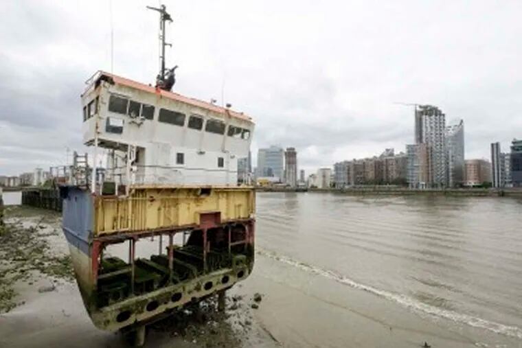 On the River Lea in London, &quot;A Slice of Reality,&quot; a cross-section of a ship, by artist Richard Wilson, is part of the outdoor sculpture walk called the Line. RAY TANG Rex Features