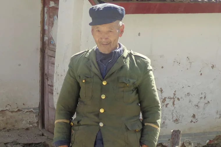 In Da Ping, China, a man proudly wears his faded army jacket. China wants to build a powerful economy, but knows that will take years. China has almost as many poor, 200 million, as the entire U.S. population.