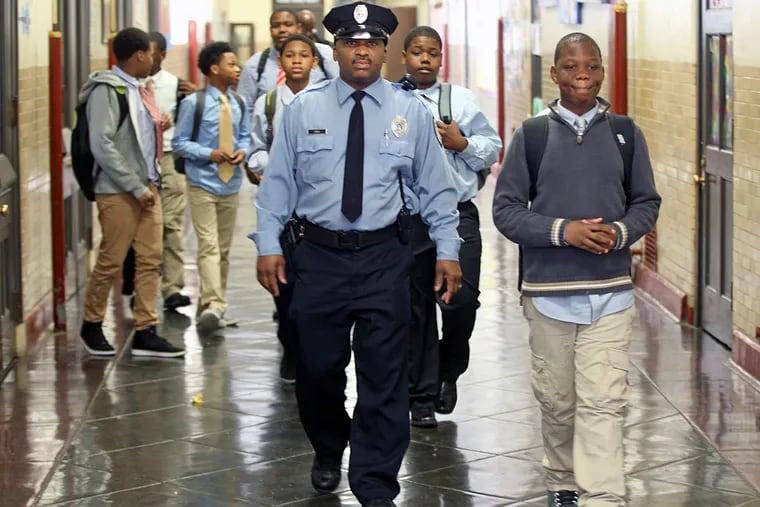 School Police Officer Donald lewis and his Men of Mitchell walking the halls of the school on their way to speak to a first-grade class at Mitchell Elementary School in Southwest Philadelphia.