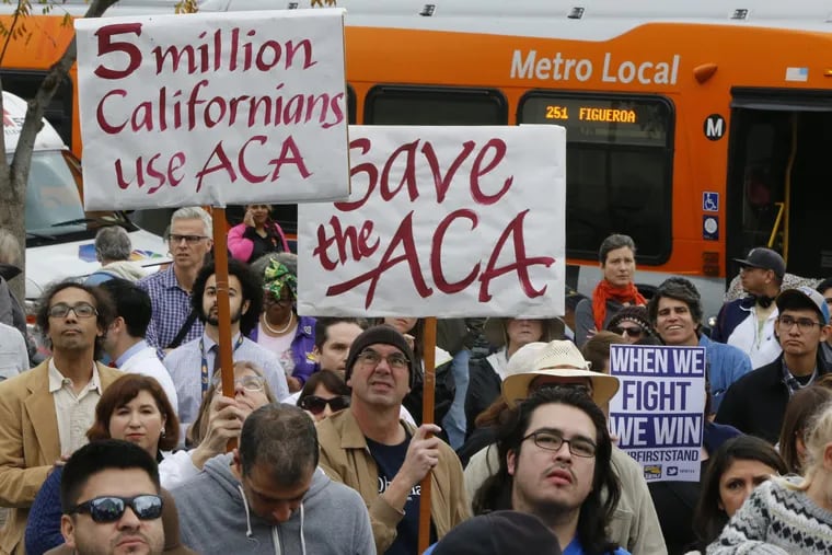 Californians join health care workers at a rally to save the Affordable Care Act across the country outside LAC+USC Medical Center in Los Angeles Sunday, Jan. 15, 2017.