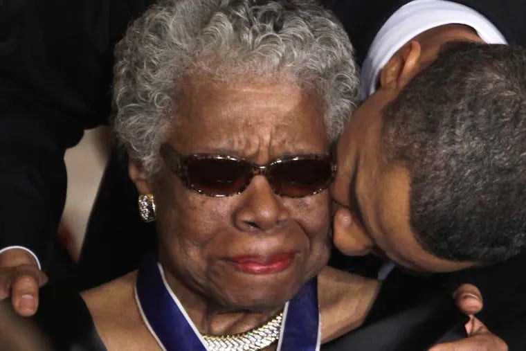 Former President Barack Obama kisses the late Maya Angelou after awarding her the 2010 Medal of Freedom at the White House.