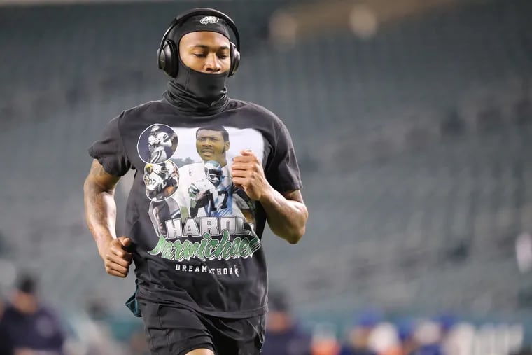 Philadelphia Eagles wide receiver DeVonta Smith warms up wearing a Harold Carmichael shirt before the Philadelphia Eagles play the Dallas Cowboys at Lincoln Financial Field in Philadelphia, Pa. on Saturday, Jan. 8, 2022.
