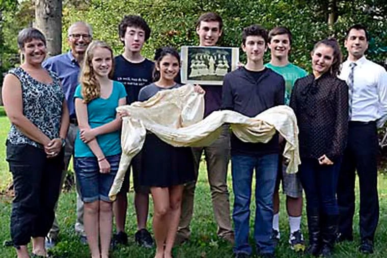 In the Moorestown backyard where Catharine Kerlin married Amos Wilder, with playwright Thornton Wilder as best man, are homeowner Stacey Jordan (left); Lenny Wagner of the Moorestown Historical Society (second from left); Moorestown High history teacher and theater director Greg Harr (right); and the student cast. (Tom Gralish / Staff Photographer)
