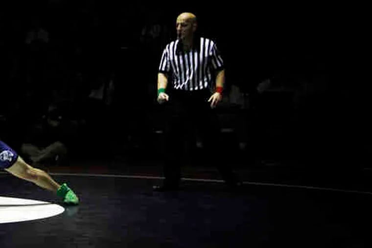 Shikellamy's Zac Cooper goes for the leg of Central Mountain's Tyler Buckwalter. Pa.'s high school wrestling is the best, Penn State's coach says.