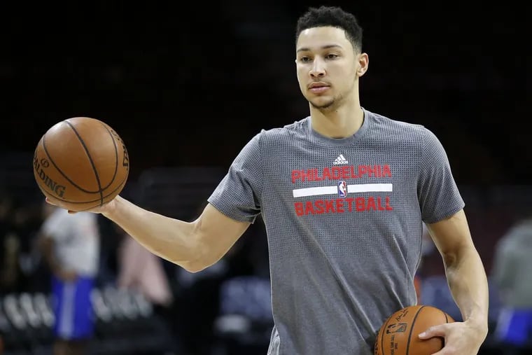 Ben Simmons holds basketballs during warm-ups before a game in January.