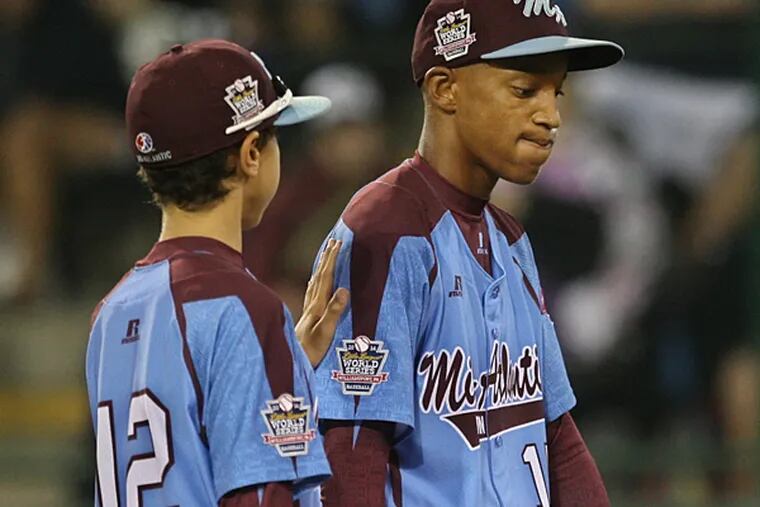 Kai Cummings (right) and Jack Rice (left) of the Taney Dragons. (Michael Bryant/Staff Photographer)