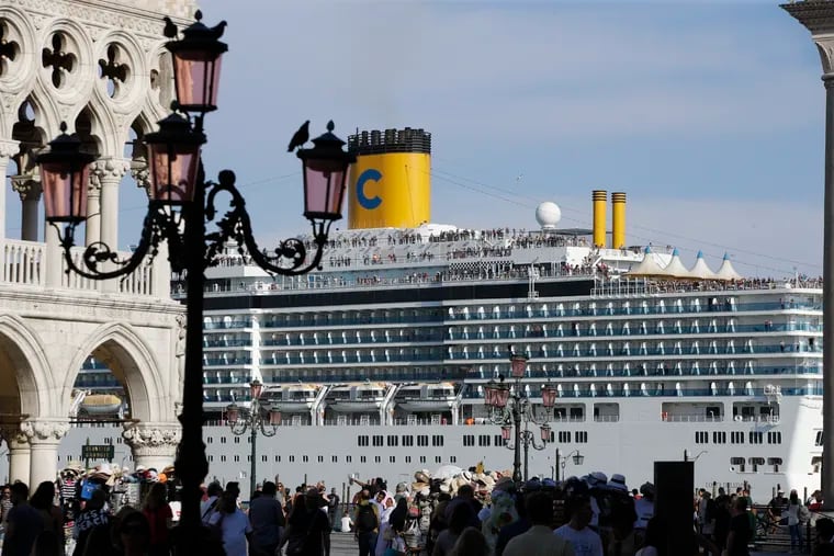 A cruise ship passes by St. Mark's Square filled with tourists in Venice, Italy in June. A cruise ship hit a tour river boat and then rammed into a dock on June 2.