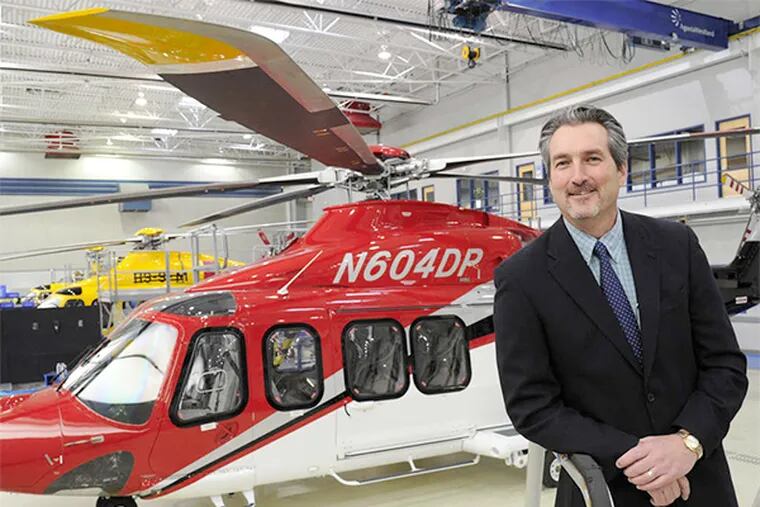 William Hunt, CEO of the U.S. operations of AgustaWestland, takes candidates on tours of the helicopter plant.