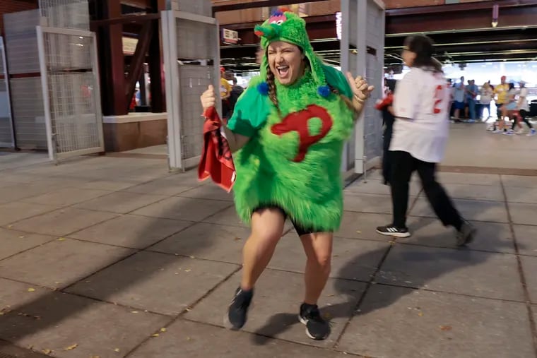Lindsey Tifft of Philadelphia dances in her homemade Phanatic outfit prior to the National League Wild-Card Series Game 2 between the Philadelphia Phillies and the Miami Marlins at Citizens Bank Park.