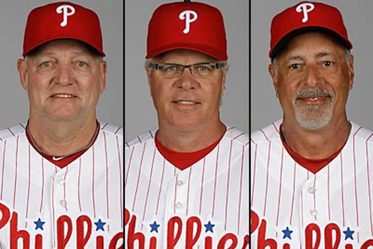 The Phillies dismissed (from left to right) Greg Gross, Pete Mackanin and Sam Perlozzo on Wednesday. (Matt Slocum/AP)