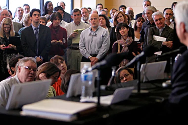 Philadelphia journalists listen to George Norcross (foreground) and the city's other new media magnates at a news conference last week. DAVID MAIALETTI  / Staff Photographer