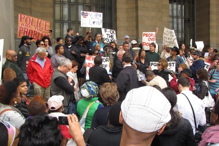 Pittsburgh residents gather in 2010 to protest the physical beating of an 18-year-old by three plainclothes police officers.